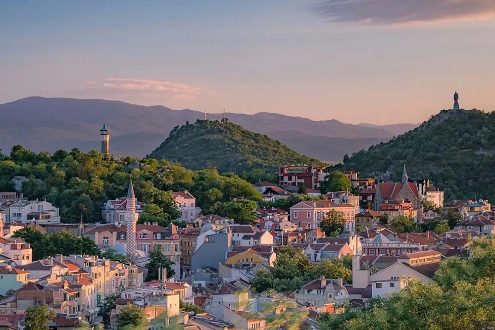 The city of Slovenia, framed by towering mountains, showcasing a stunning natural landscape