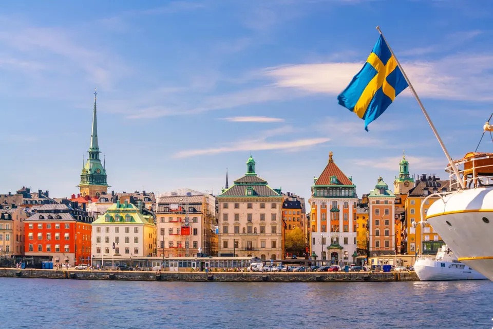 A vibrant cityscape of Stockholm, Sweden, showcasing the Swedish flag amidst the urban landscape